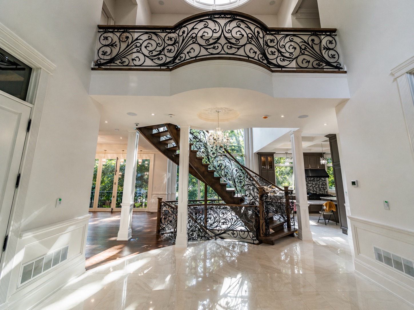 Luxury foyer with sweeping staircase, Level 5 drywall finish in North York