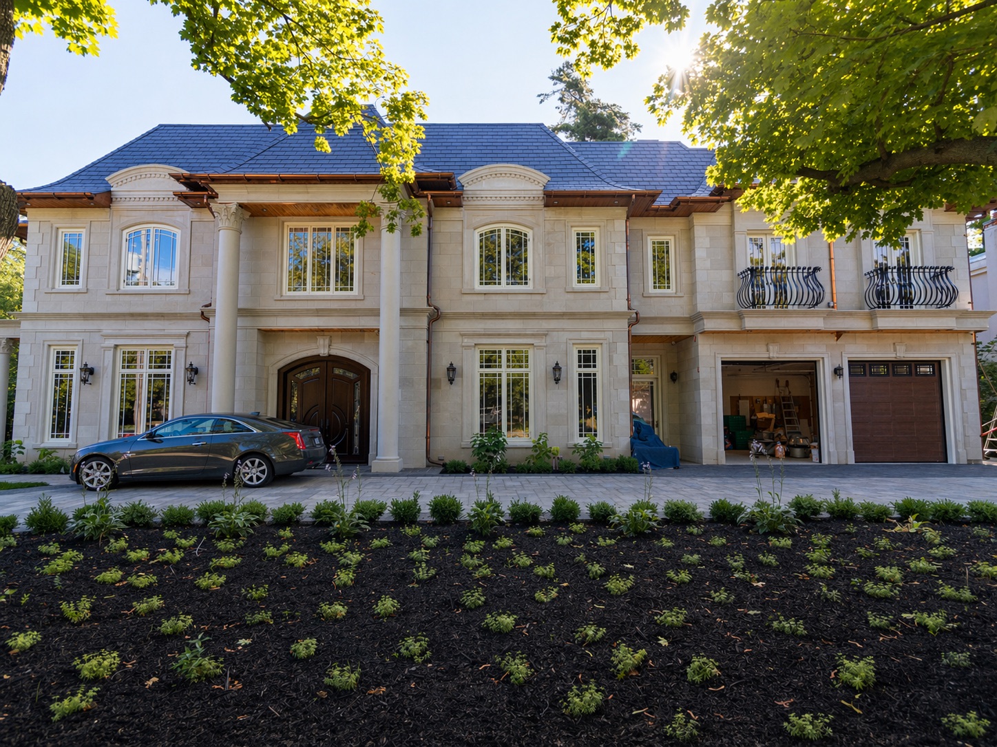 Elegant stone-clad mansion exterior — completed full-home renovation, Toronto