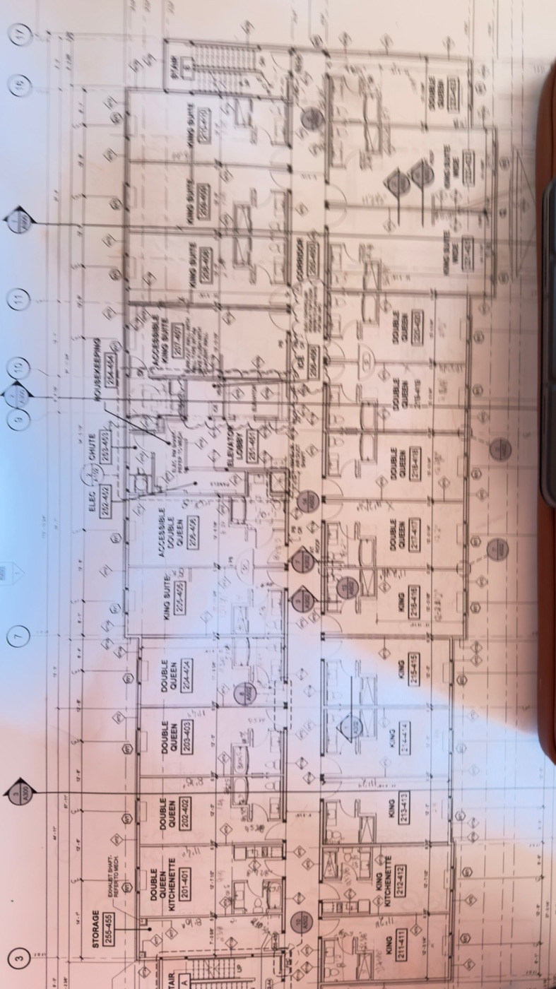 Architectural drawings on site for a commercial drywall project in Ontario