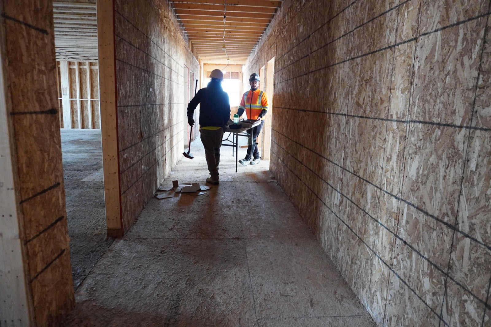 Crew working in a framed hotel corridor in Ontario