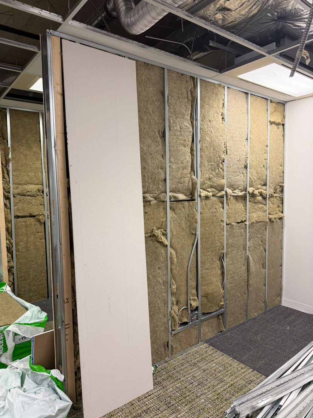 Mineral wool batts in a partition