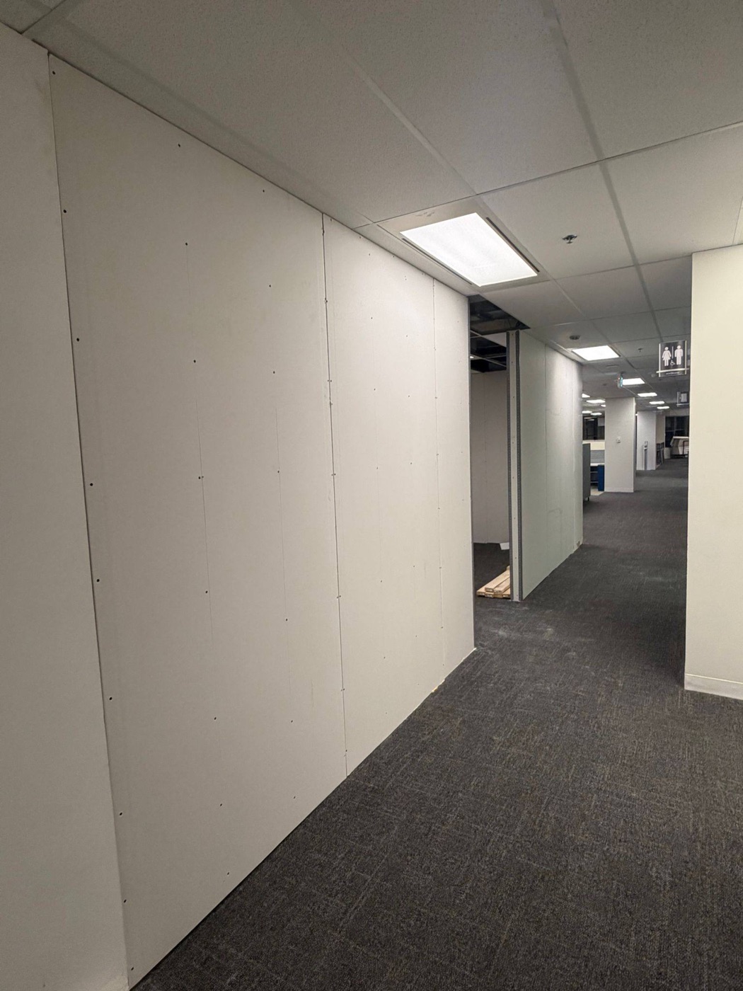 Boarded corridor wall