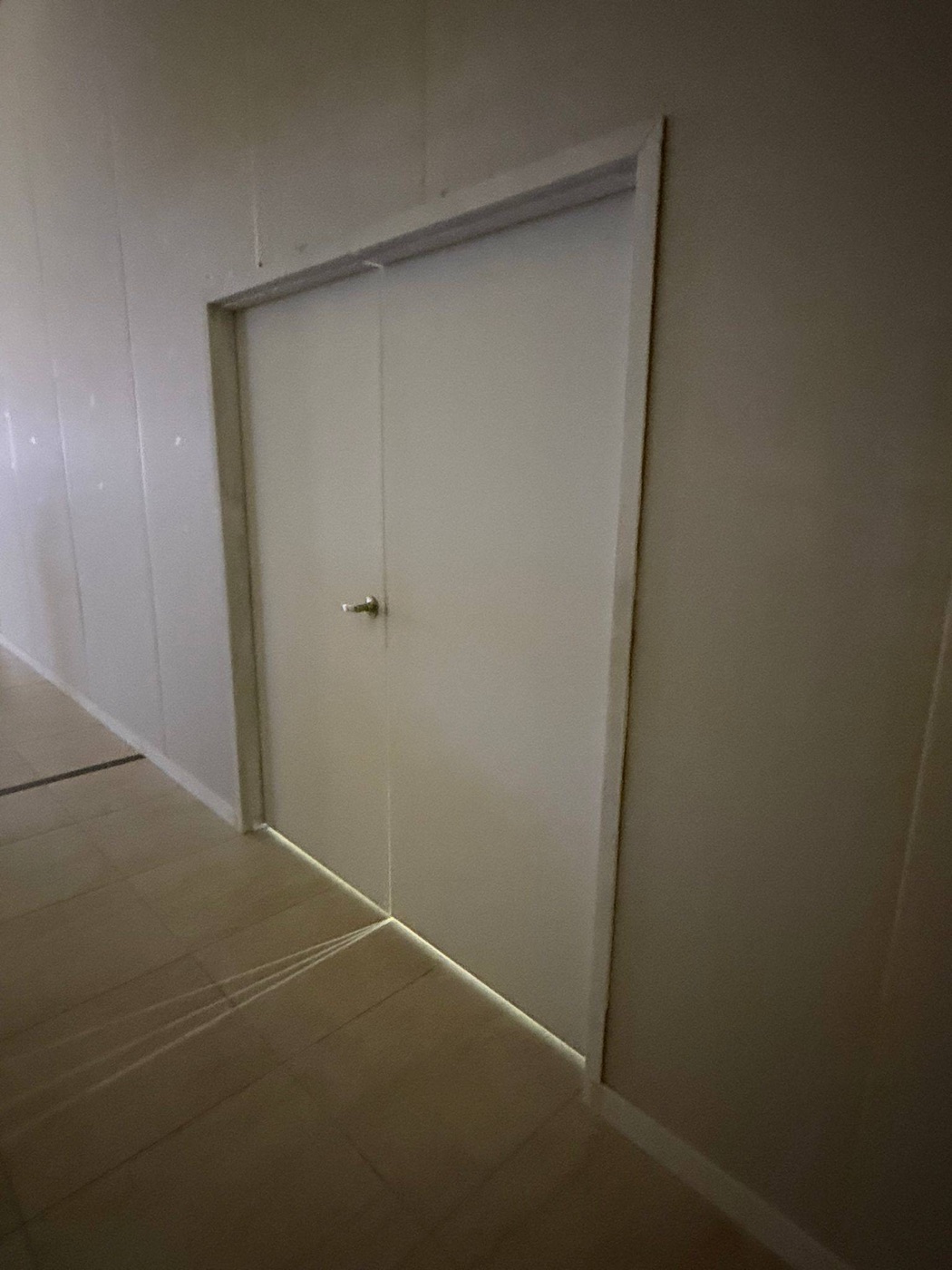 Door installed in a finished partition