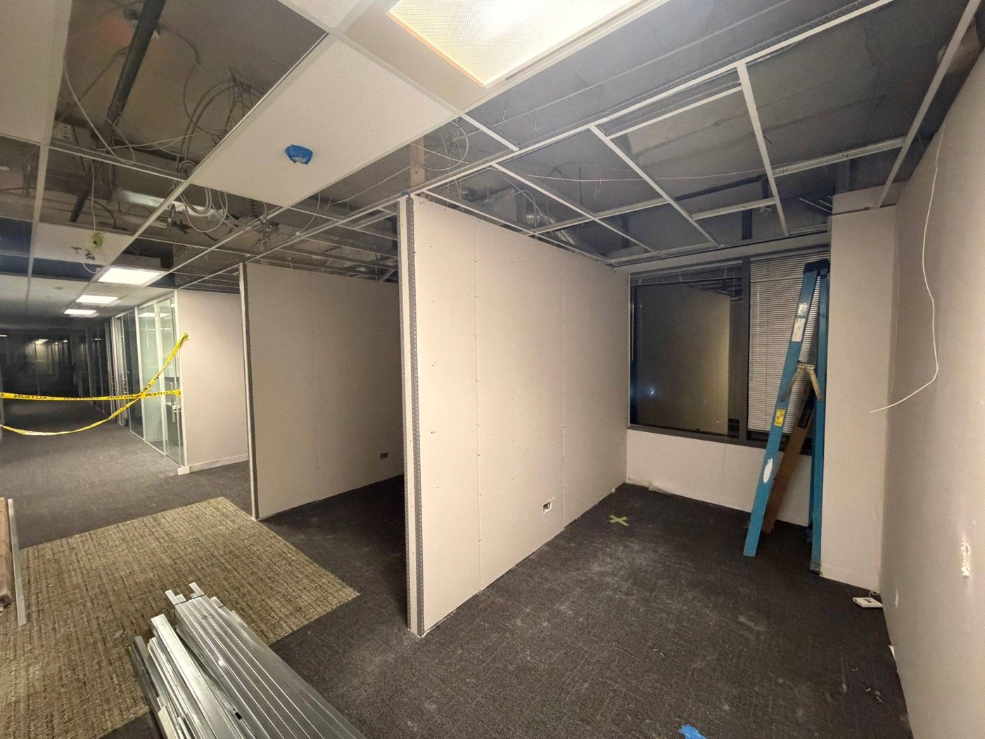 Steel stud framed private office under an existing T-bar ceiling in a Woodbridge office fit-out