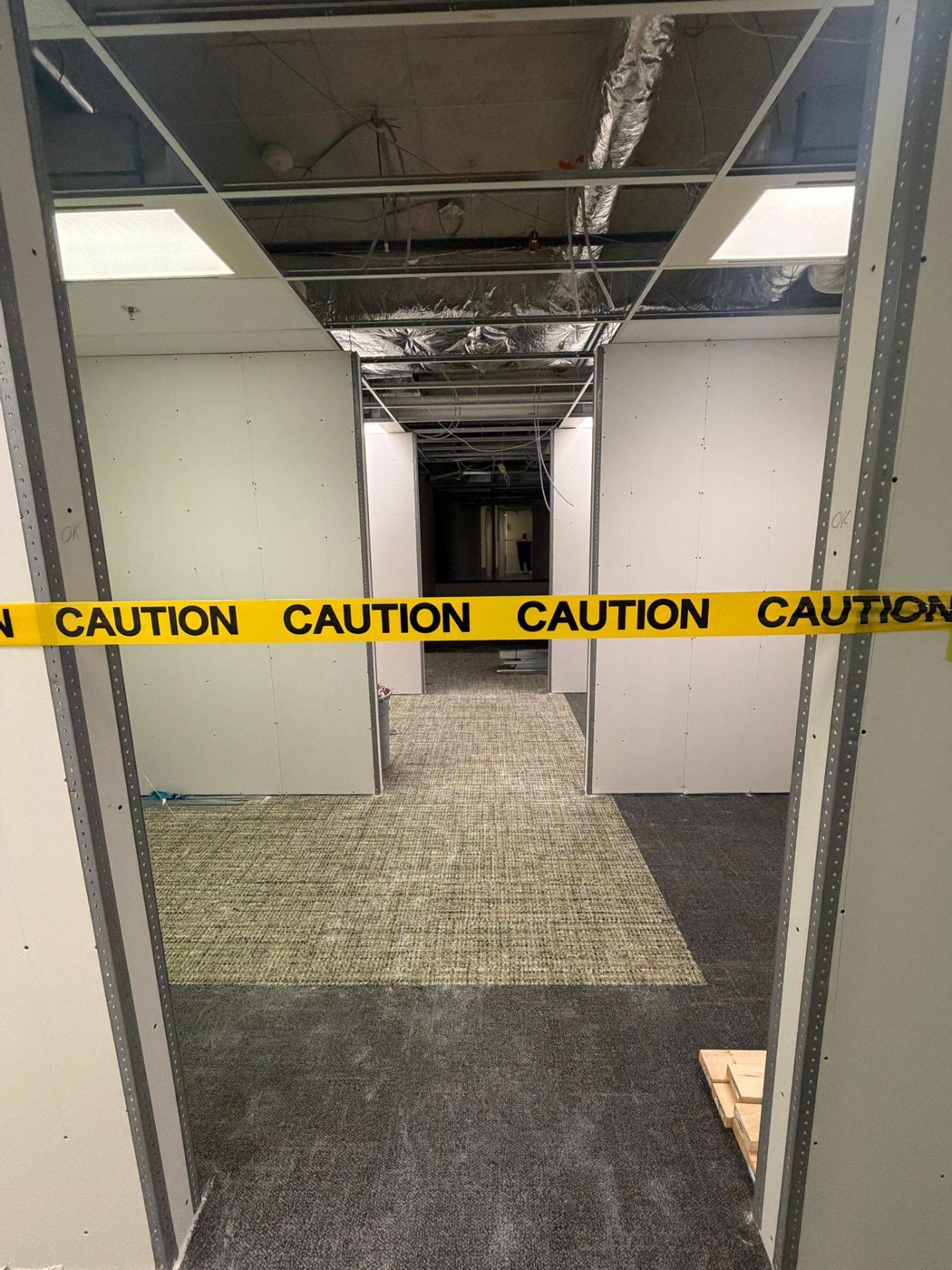 Work zone taped off inside an occupied building